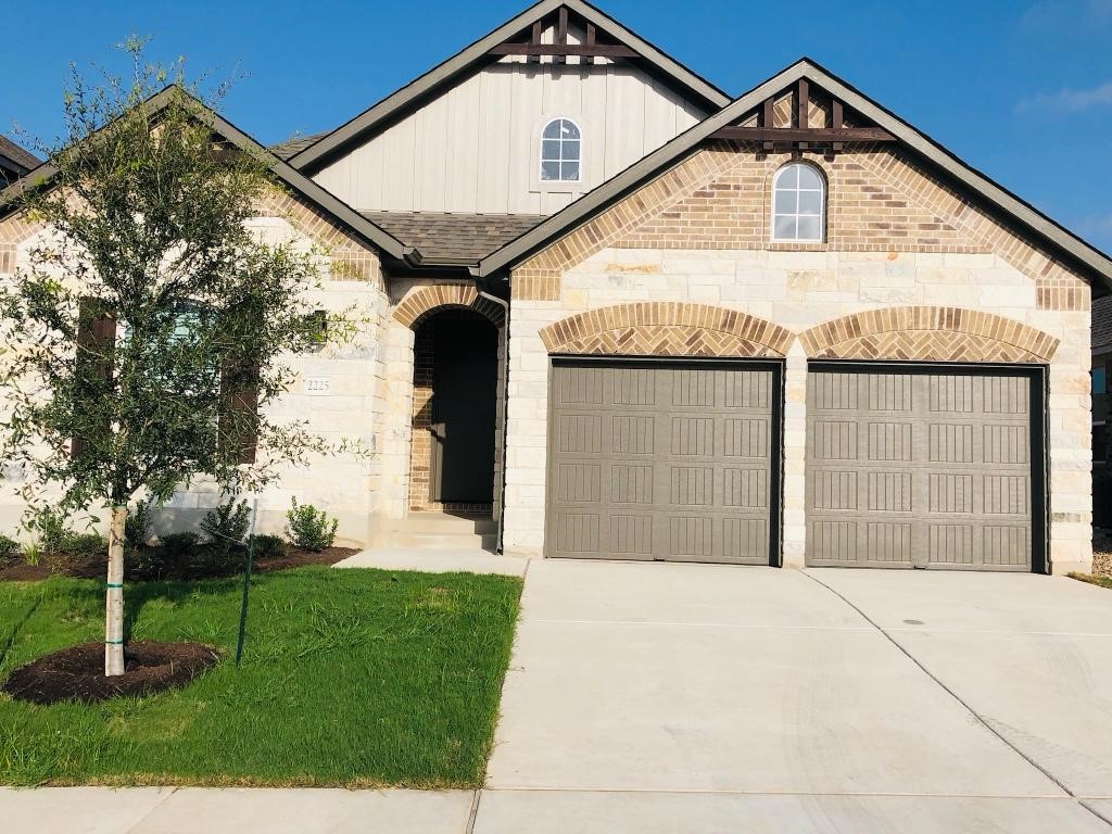 2225 Base Burner Path Leander, TX 78641 - Photo 1 of 1 a front view of a house with garden