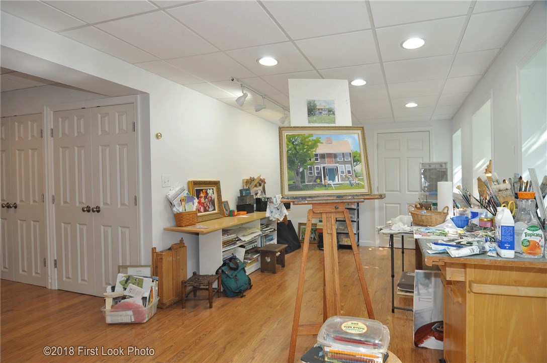 15 Blue Ridge Drive Charlestown, RI 02813 - Photo 23 of 36 Lower level studio with full sized windows. Bulkhead out of workshop.