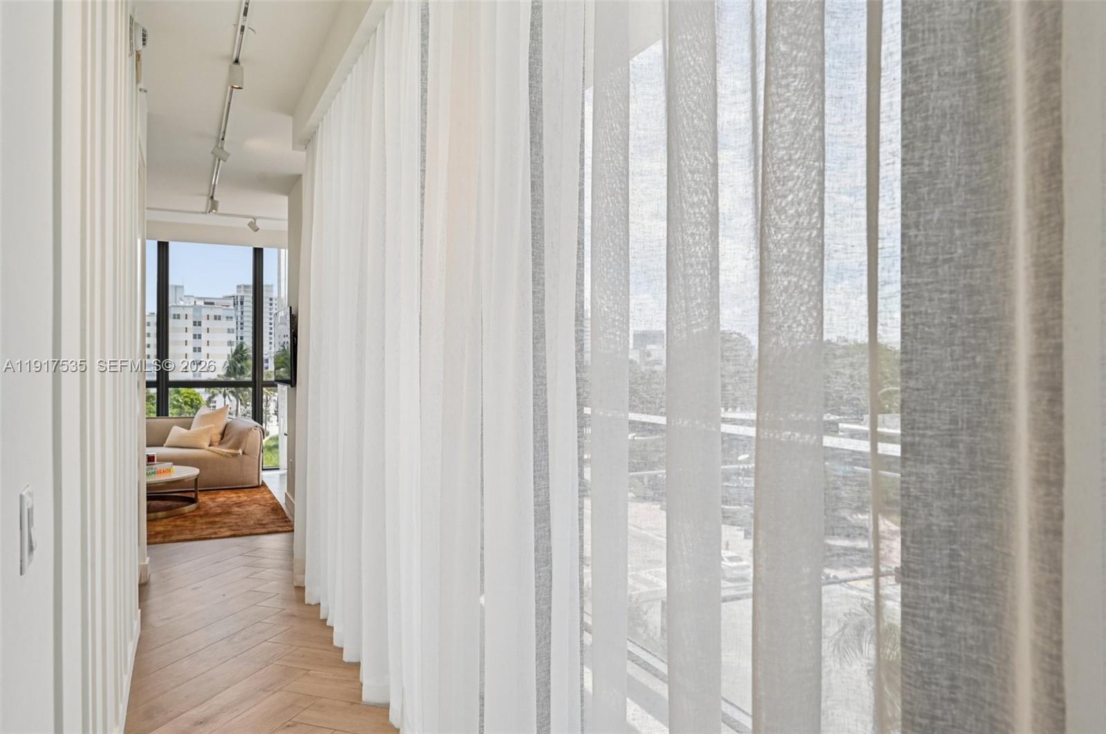 2201 Collins Avenue, Unit 401 Miami Beach, FL 33139 - Photo 11 of 20 a en suite bathroom with a glass shower door