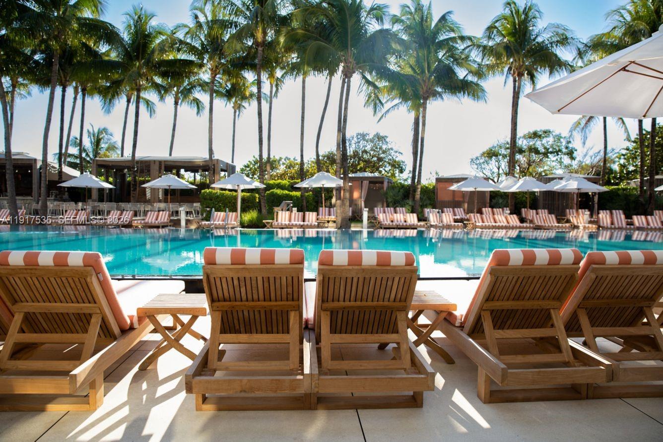 2201 Collins Avenue, Unit 401 Miami Beach, FL 33139 - Photo 14 of 20 a view of outdoor space with seating area and swimming pool
