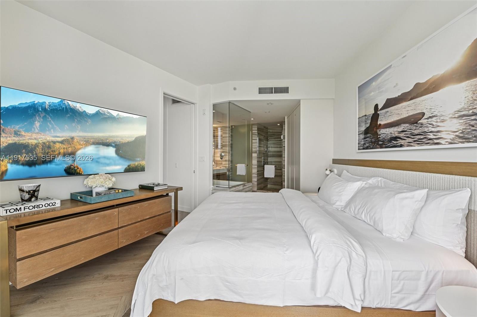 2201 Collins Avenue, Unit 401 Miami Beach, FL 33139 - Photo 3 of 20 a bedroom with bed and window