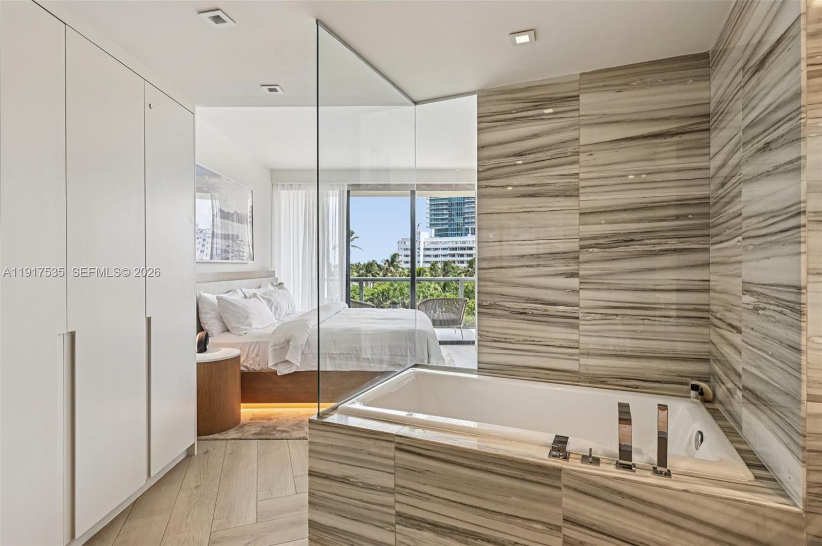 2201 Collins Avenue, Unit 401 Miami Beach, FL 33139 - Photo 4 of 20 a view of a living room and bathroom