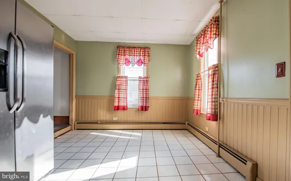 a view of a brick house with wooden floor