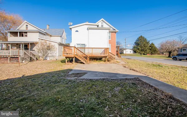 a view of a house with a yard and garage