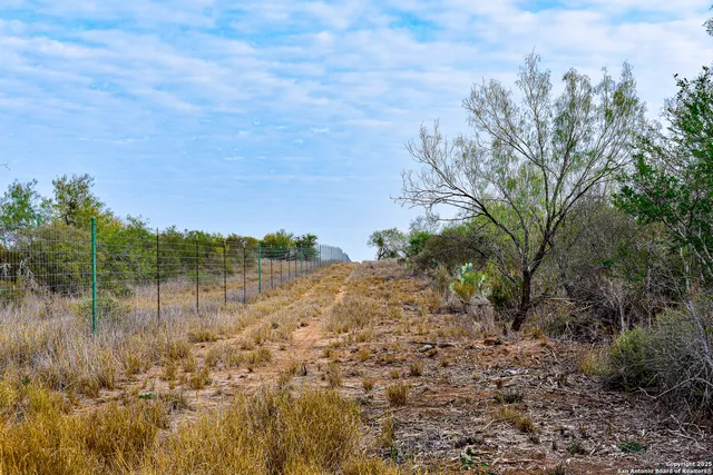 a view of lake with green space