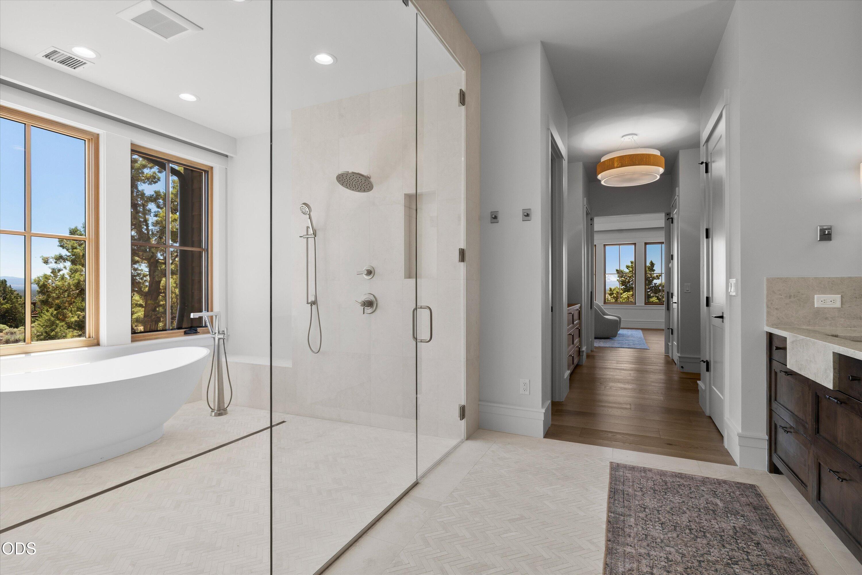 16215 South W Vaqueros Way Powell Butte, OR 97753 - Photo 20 of 48 Radiant heated floors, one-touch window treatments, and luxury finishes are only some of the special touches added to every inch of this home