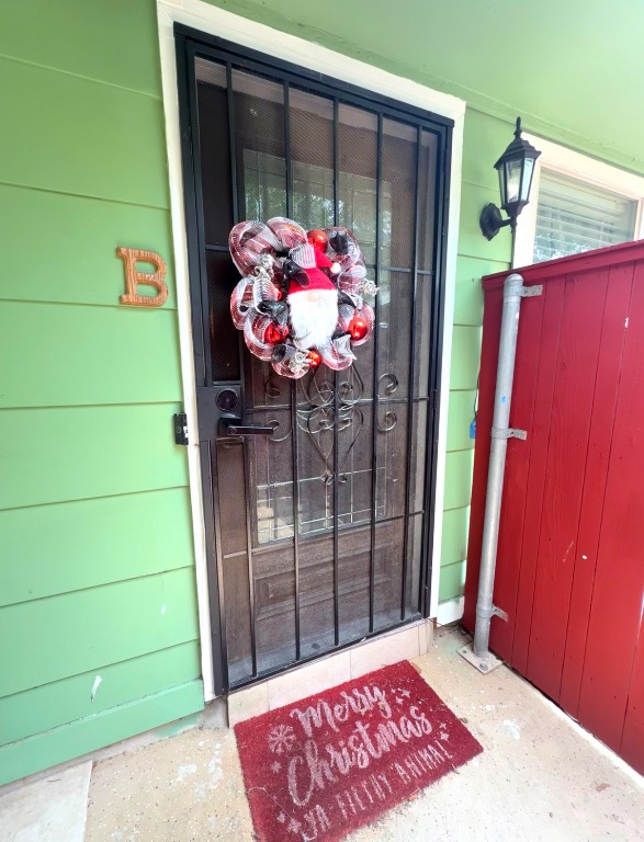 7707 Eastcrest Drive, Unit B Austin, TX 78752 - Photo 2 of 11 a view of a door with a bench