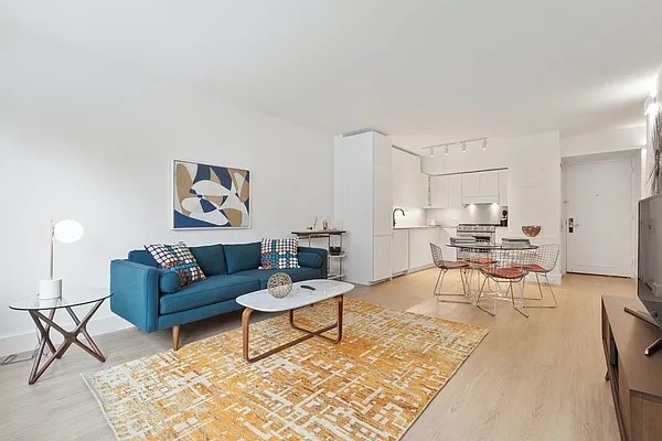 160 West 24th Street, Unit 14K Manhattan, NY 10011 - Photo 2 of 11 a living room with furniture and view of kitchen