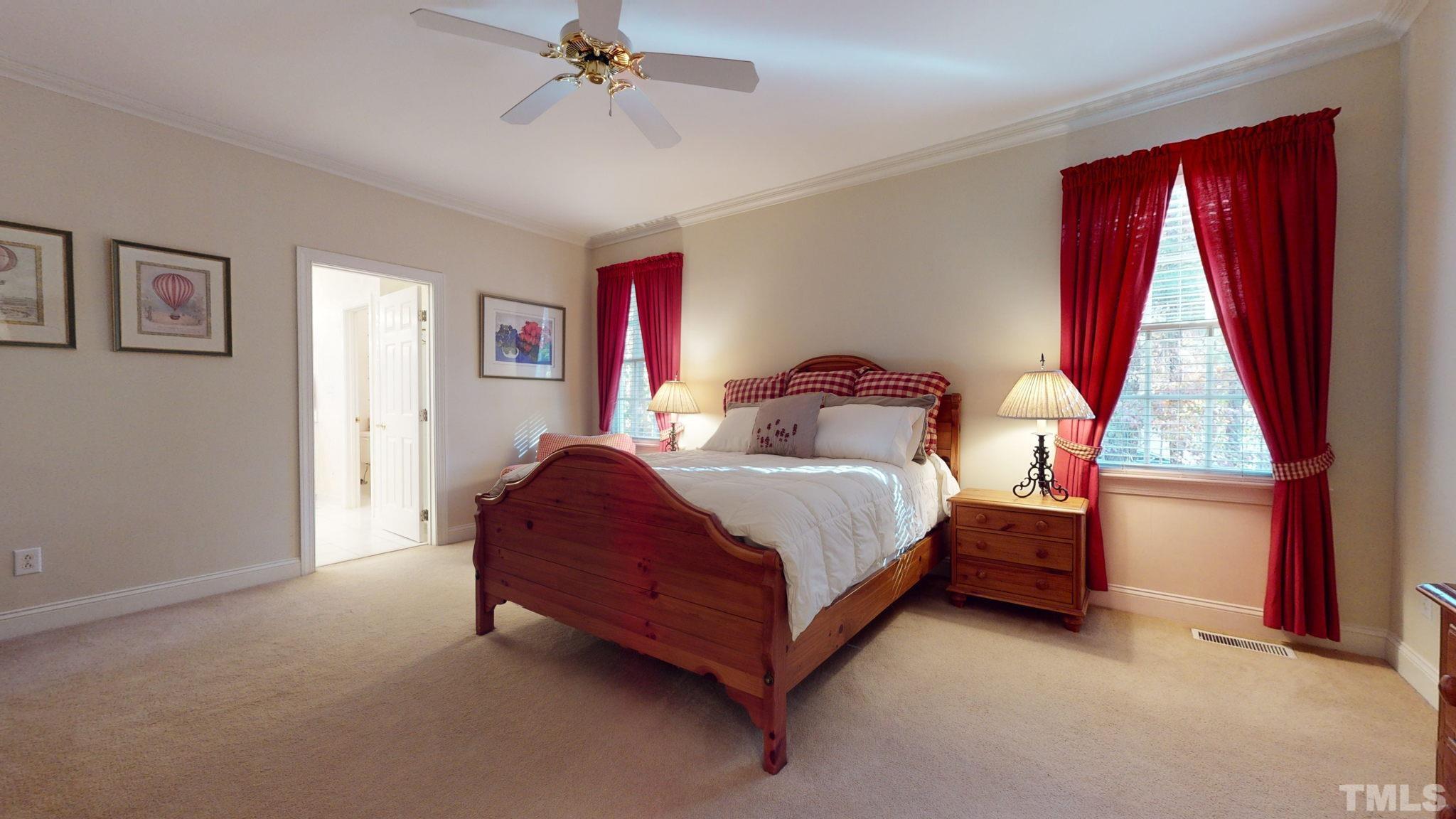 1024 White Crane Way Raleigh, NC 27615 - Photo 14 of 30 a bedroom with a bed and window