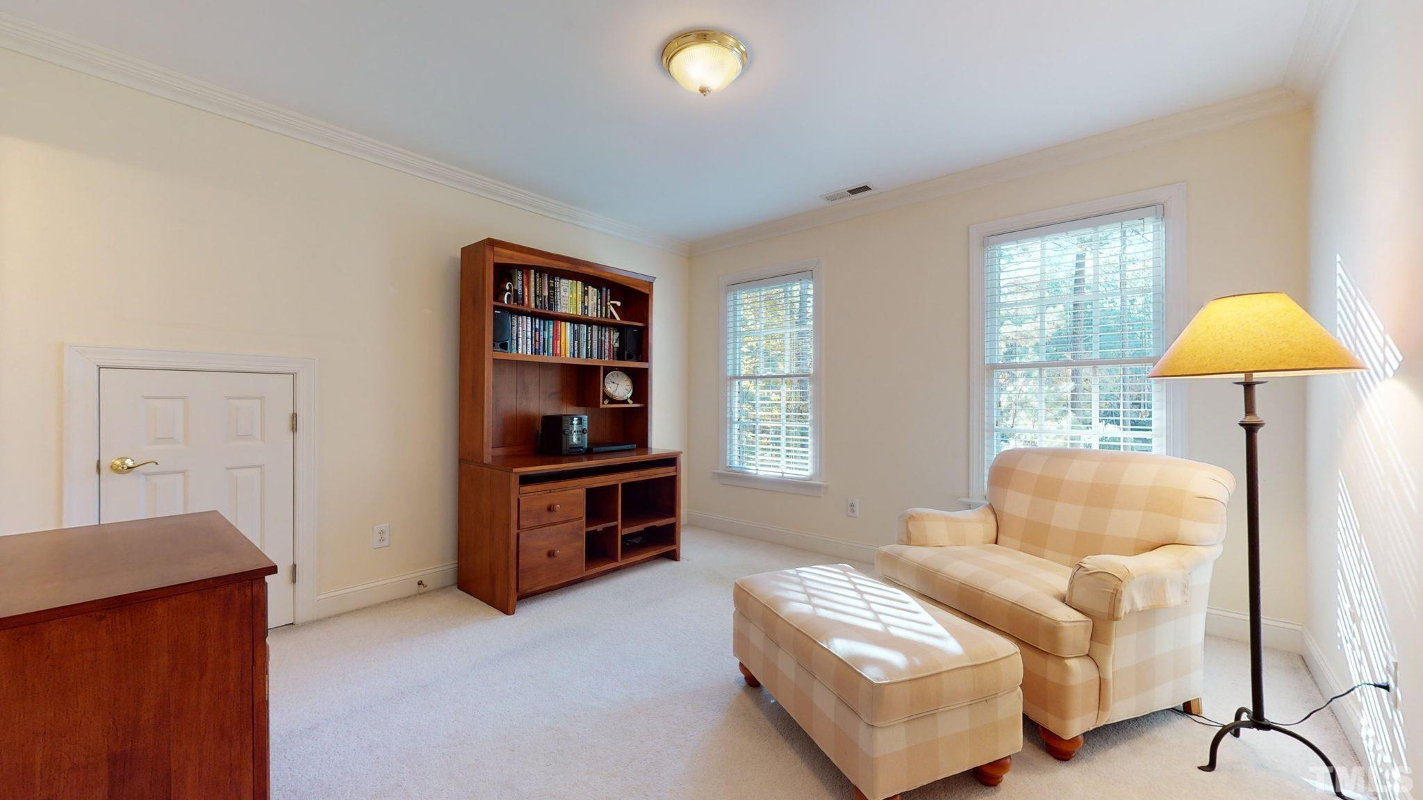 1024 White Crane Way Raleigh, NC 27615 - Photo 17 of 30 a living room with furniture and a window