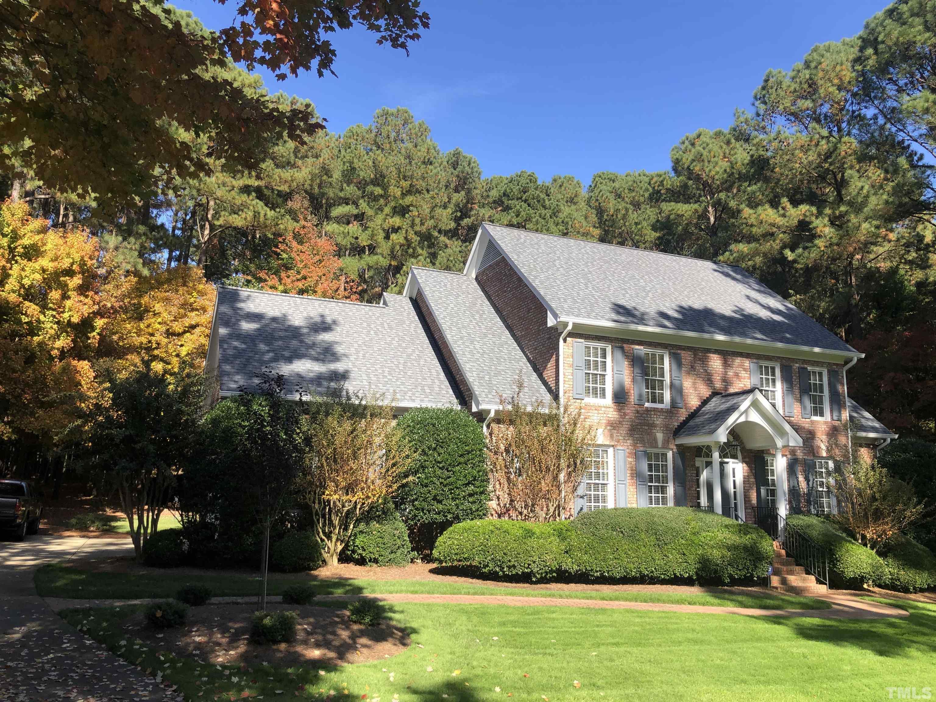 1024 White Crane Way Raleigh, NC 27615 - Photo 3 of 30 a view of a white house next to a yard with big trees