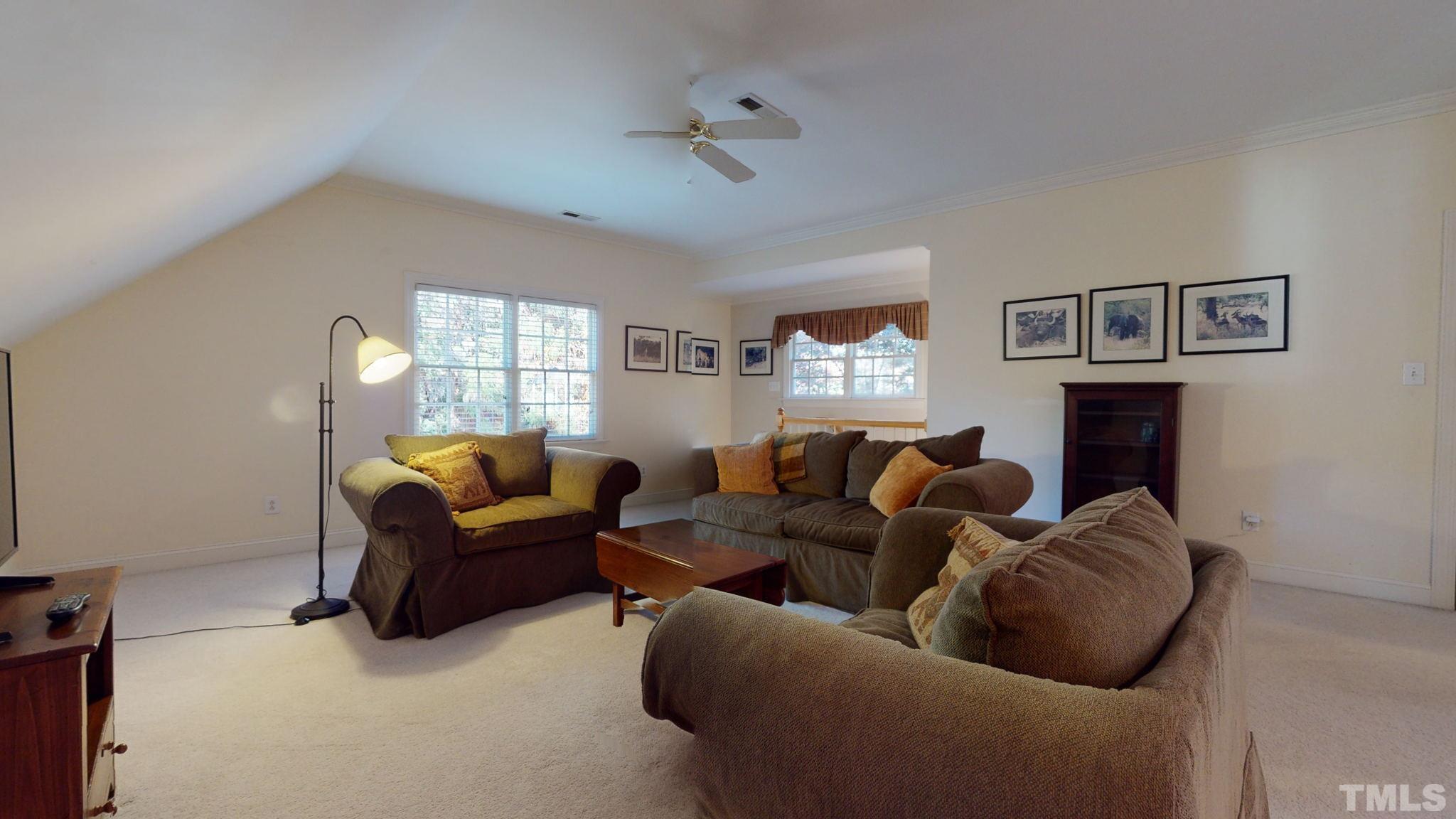 1024 White Crane Way Raleigh, NC 27615 - Photo 22 of 30 a living room with fireplace furniture and a window