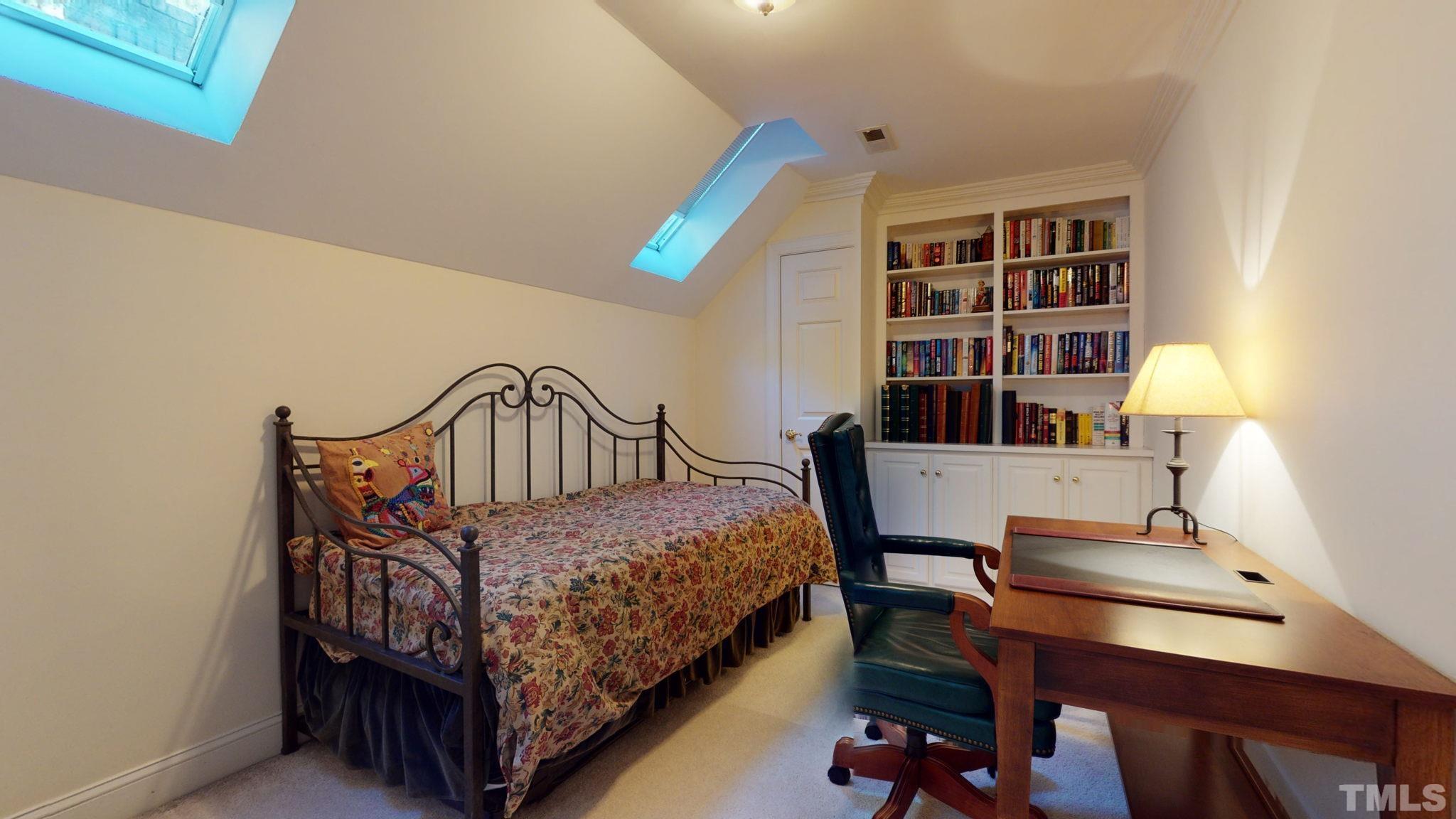 1024 White Crane Way Raleigh, NC 27615 - Photo 24 of 30 a bedroom with a bed window and a table in it