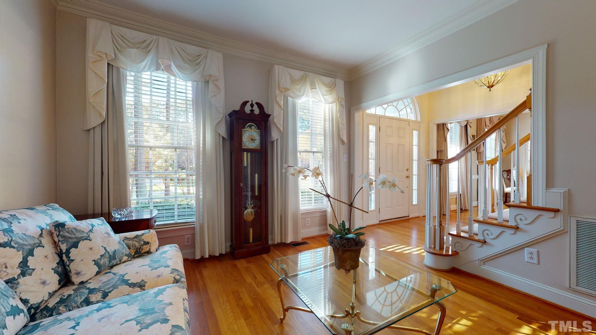 1024 White Crane Way Raleigh, NC 27615 - Photo 6 of 30 a living room with furniture and large windows