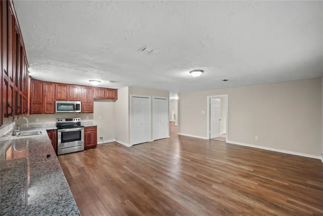 a view of kitchen with wooden floor