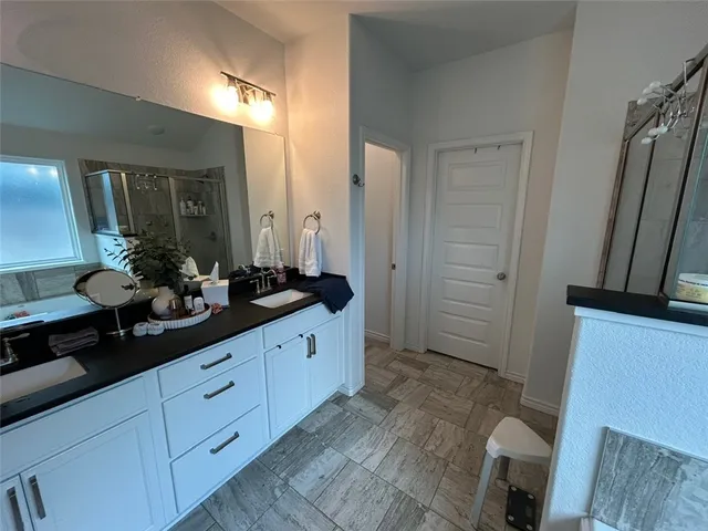 a kitchen with stainless steel appliances a refrigerator a sink a stove and cabinets