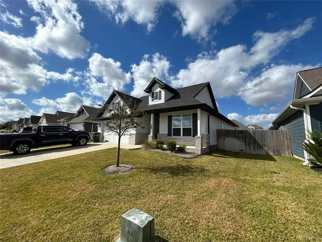 a view of a house with swimming pool and porch