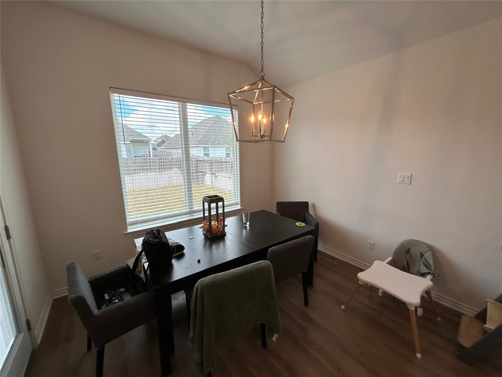 3169 Normandy Way Bryan, TX 77808 - Photo 6 of 24 a table and chairs in a room