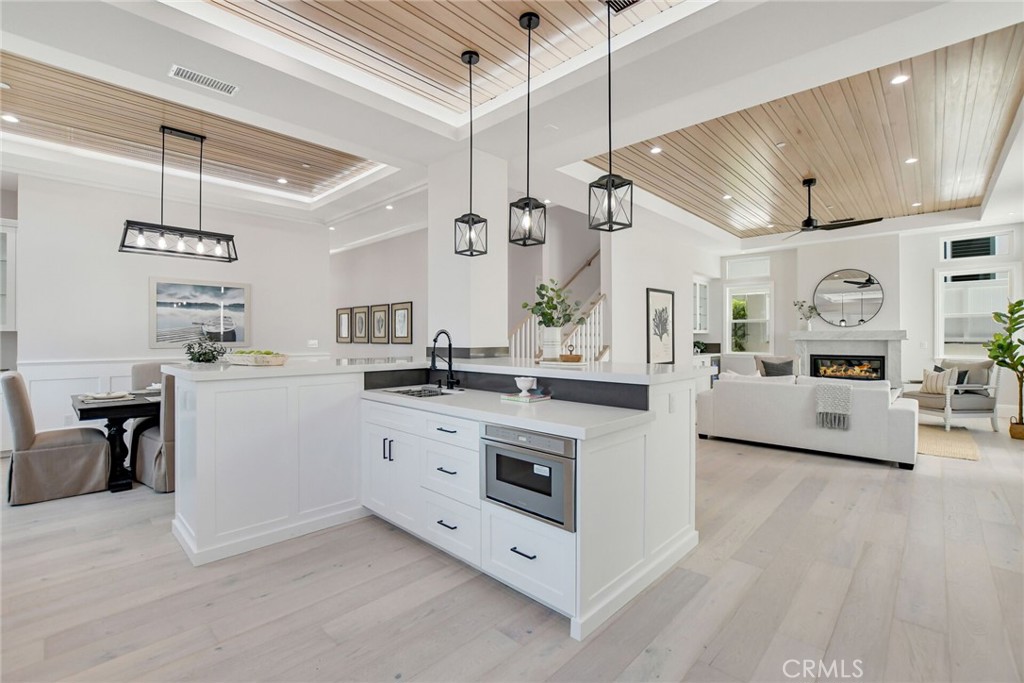 1725 Clark Lane Redondo Beach, CA 90278 - Photo 15 of 47 a kitchen with stainless steel appliances kitchen island granite countertop a stove and white cabinets