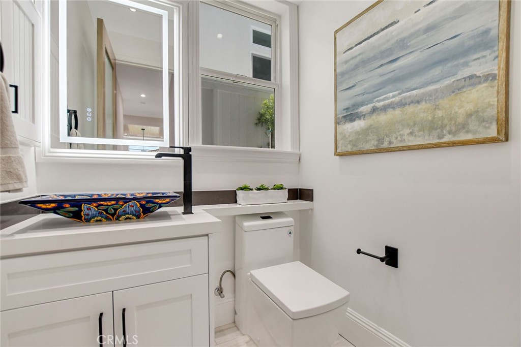 1725 Clark Lane Redondo Beach, CA 90278 - Photo 22 of 47 a bathroom with a sink and a stove