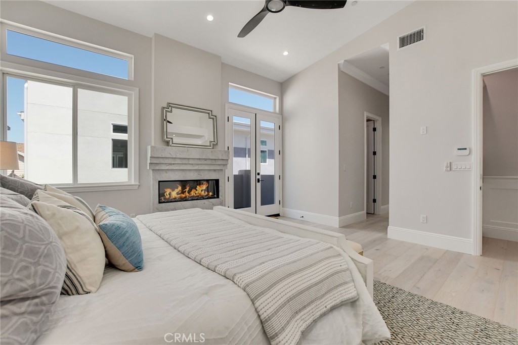 1725 Clark Lane Redondo Beach, CA 90278 - Photo 26 of 47 a bedroom with a bed and a fireplace