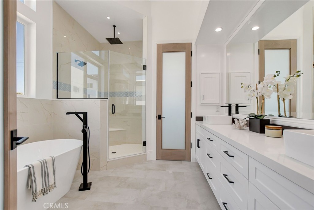 1725 Clark Lane Redondo Beach, CA 90278 - Photo 28 of 47 a bathroom with a double vanity sink mirror and shower