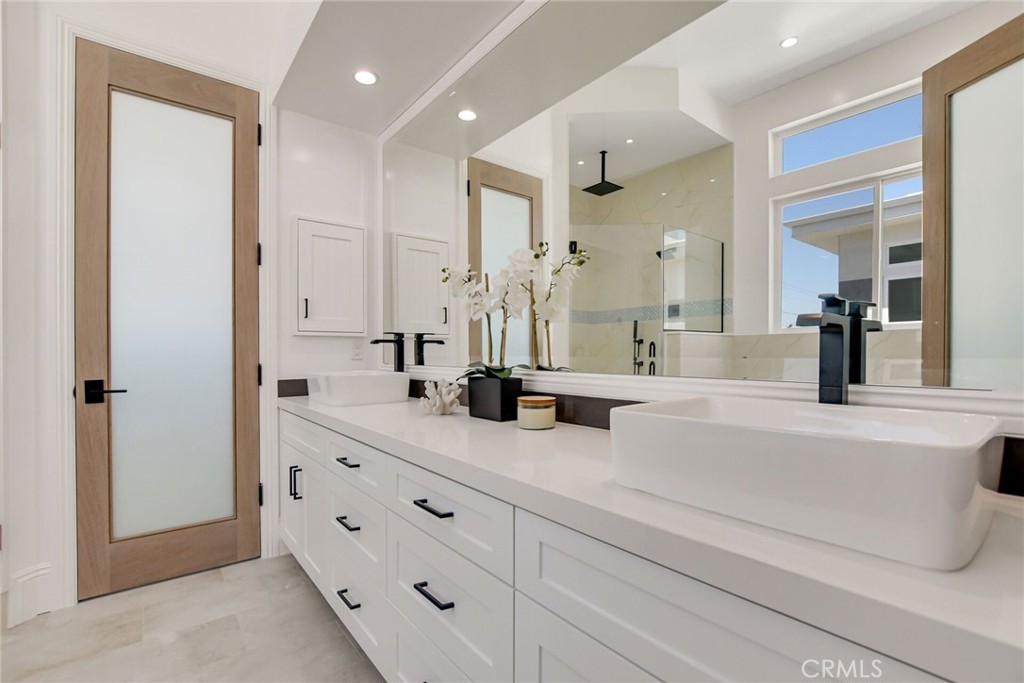 1725 Clark Lane Redondo Beach, CA 90278 - Photo 31 of 47 a spacious bathroom with double vanity a mirror and shower