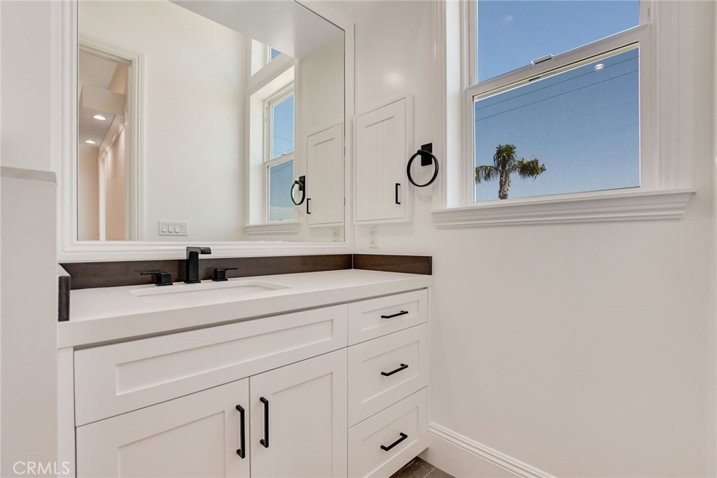 1725 Clark Lane Redondo Beach, CA 90278 - Photo 34 of 47 a bathroom with a sink and a mirror