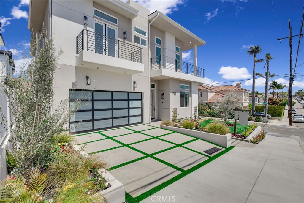 1725 Clark Lane Redondo Beach, CA 90278 - Photo 4 of 47 a front view of a building with a garden and plants