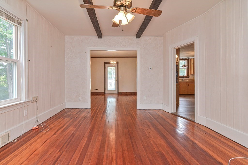 775 3rd Avenue Woonsocket, RI 02895 - Photo 11 of 42 a view of empty room with wooden floor and fan