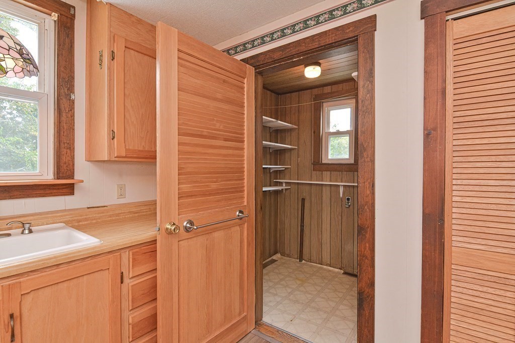 775 3rd Avenue Woonsocket, RI 02895 - Photo 18 of 42 a bathroom with a sink and a mirror