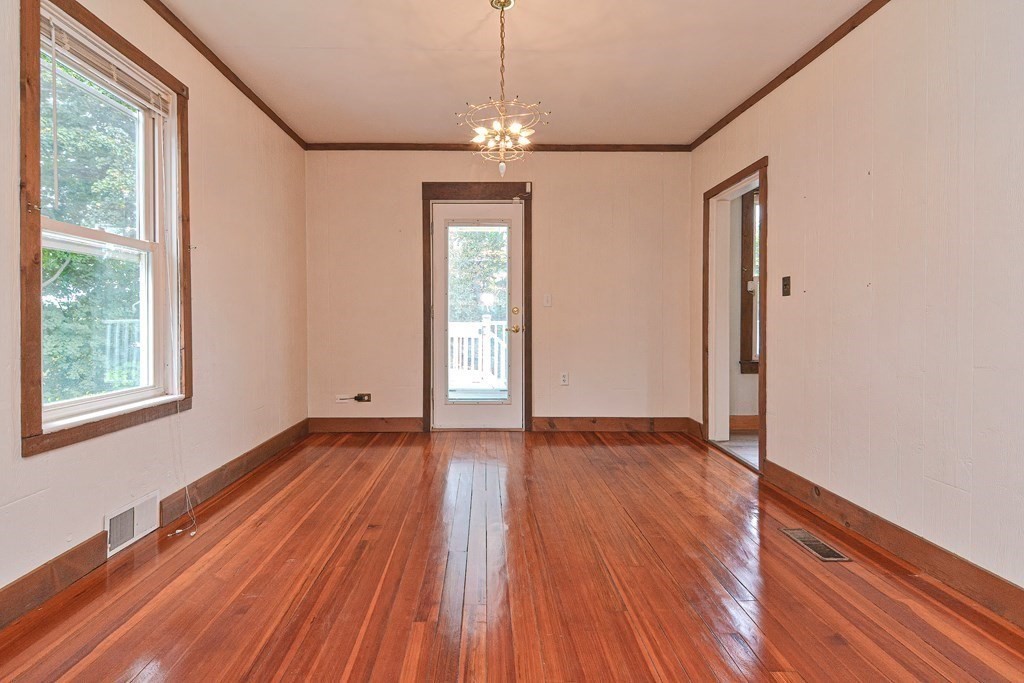 775 3rd Avenue Woonsocket, RI 02895 - Photo 19 of 42 a view of an empty room with wooden floor and a window