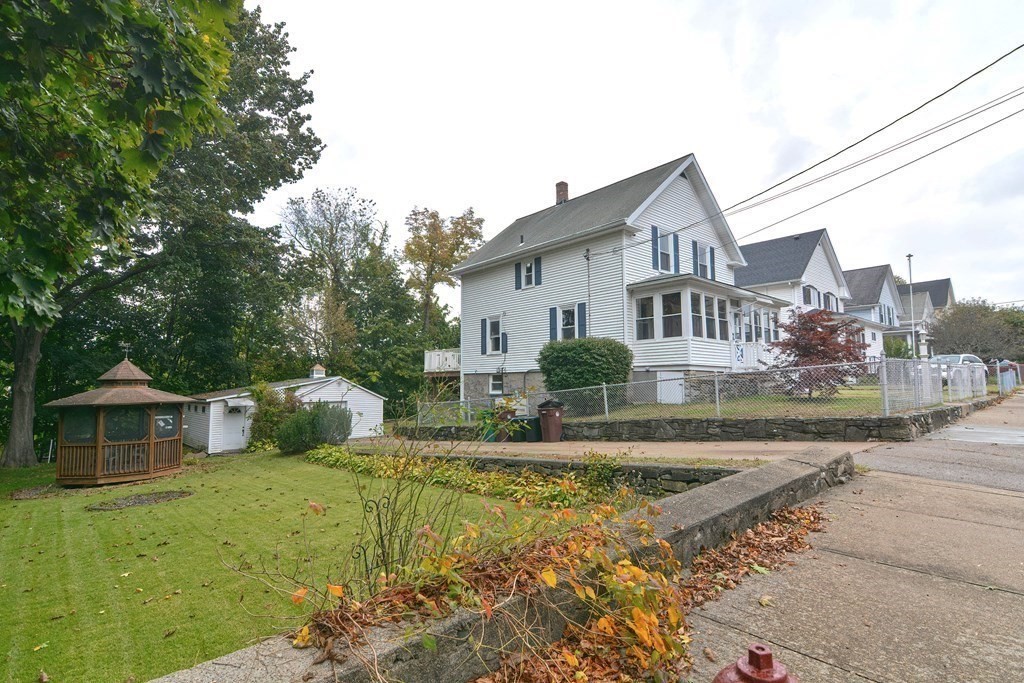 775 3rd Avenue Woonsocket, RI 02895 - Photo 2 of 42 a view of a house with backyard and sitting area