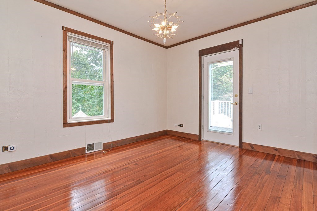 775 3rd Avenue Woonsocket, RI 02895 - Photo 22 of 42 a view of an empty room with wooden floor and a window