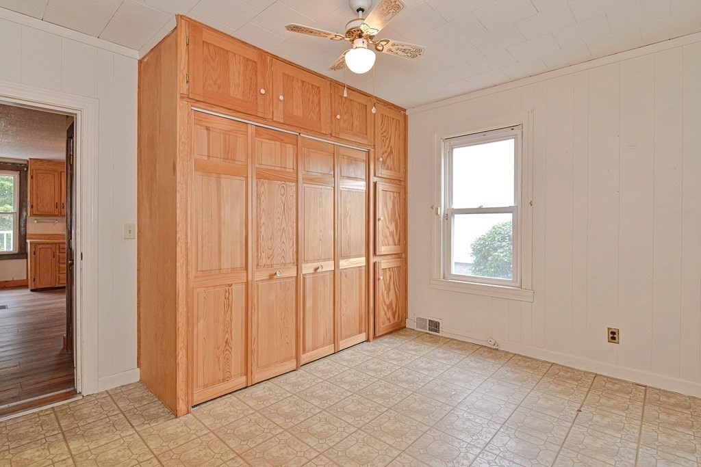 775 3rd Avenue Woonsocket, RI 02895 - Photo 24 of 42 an empty room with fan and windows