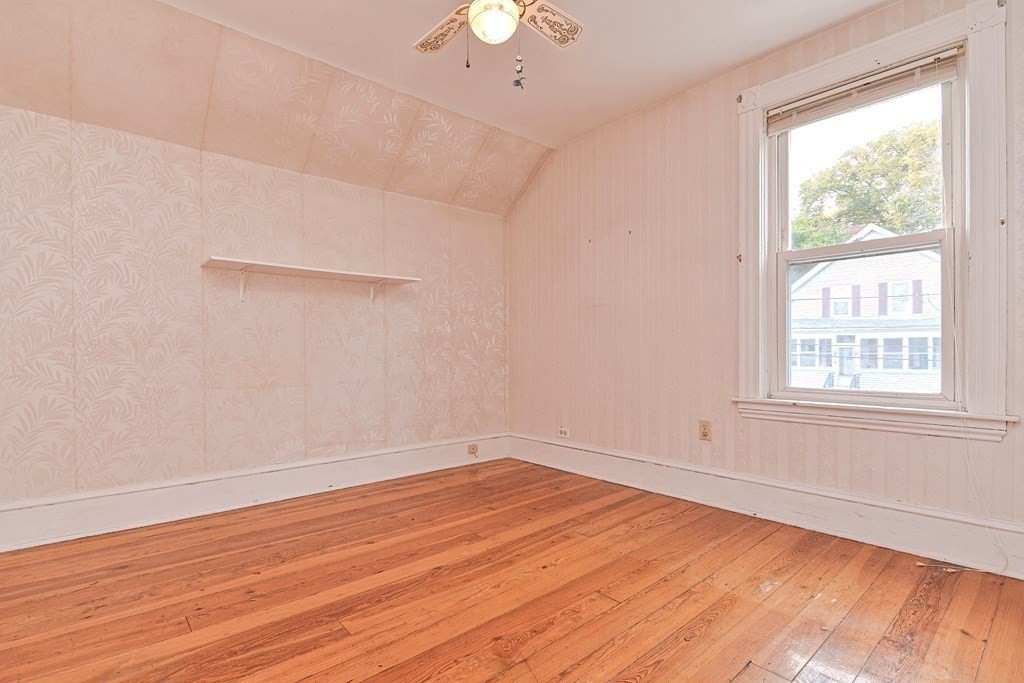 775 3rd Avenue Woonsocket, RI 02895 - Photo 30 of 42 wooden floor in an empty room with a window