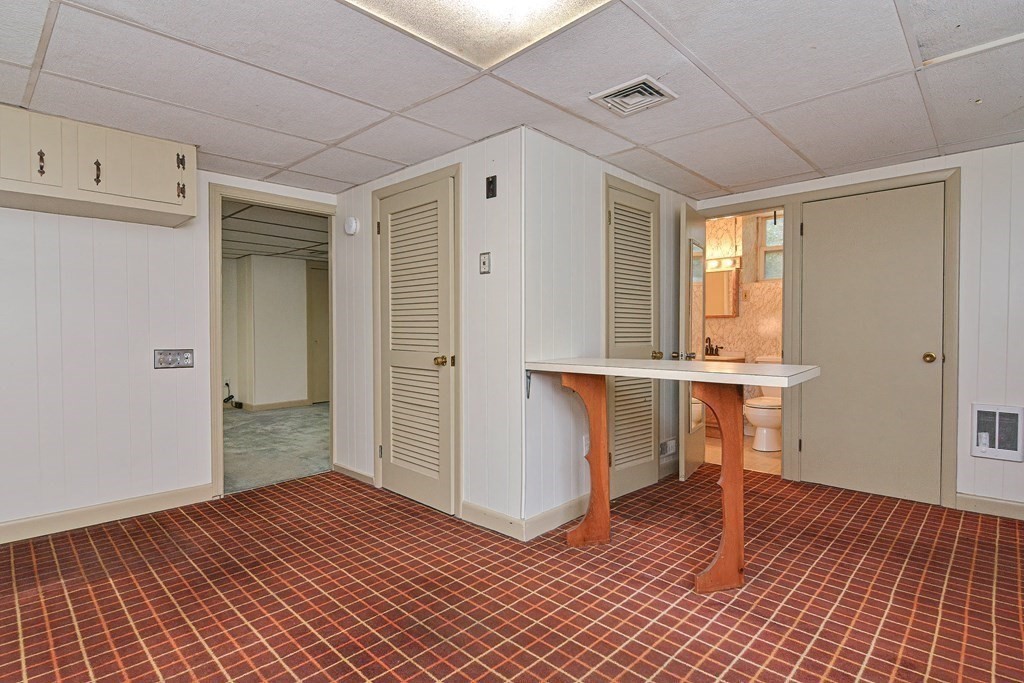 775 3rd Avenue Woonsocket, RI 02895 - Photo 33 of 42 a view of a hallway and wooden floor with a bathroom