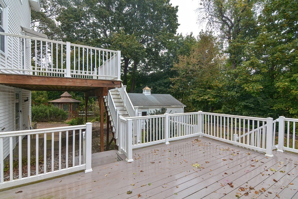 775 3rd Avenue Woonsocket, RI 02895 - Photo 36 of 42 a view of a wooden deck and a yard with swimming pool