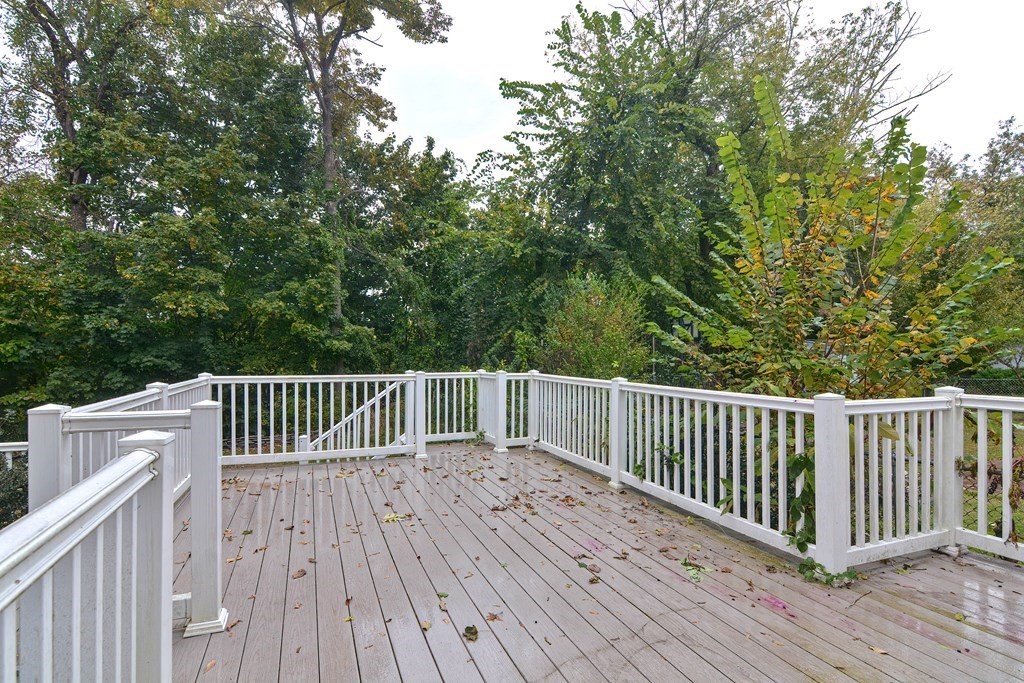 775 3rd Avenue Woonsocket, RI 02895 - Photo 38 of 42 a view of deck with wooden floor and fence