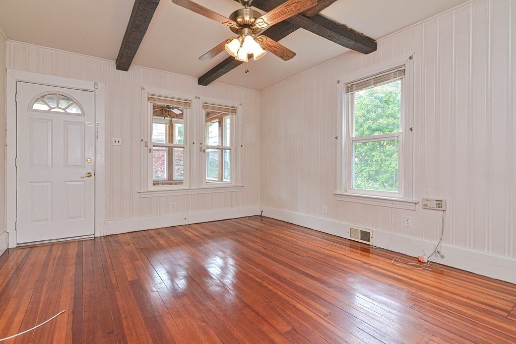 775 3rd Avenue Woonsocket, RI 02895 - Photo 8 of 42 wooden floor in an empty room with a window