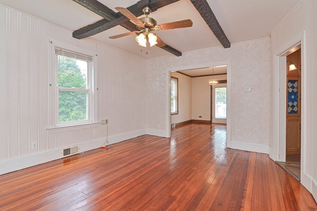775 3rd Avenue Woonsocket, RI 02895 - Photo 9 of 42 a view of an empty room with wooden floor and a window