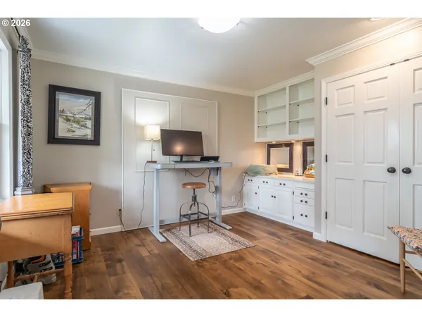 a room with furniture and a flat screen tv