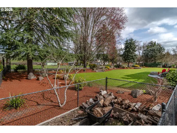 a view of a park with swings and slides