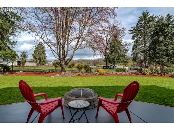 a view of a chairs and table in the garden