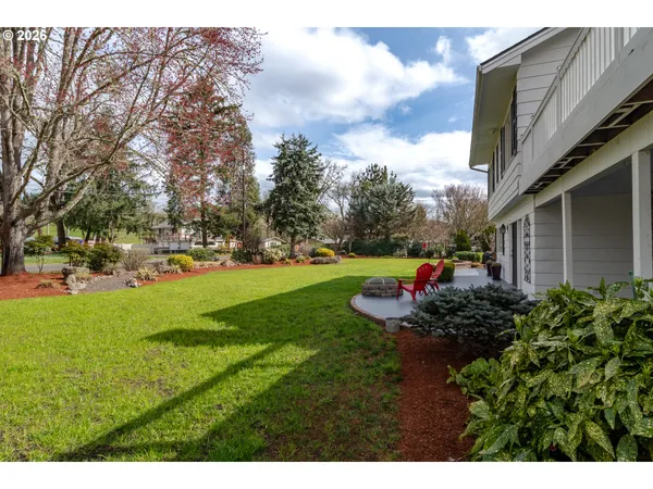 a view of a backyard with sitting area