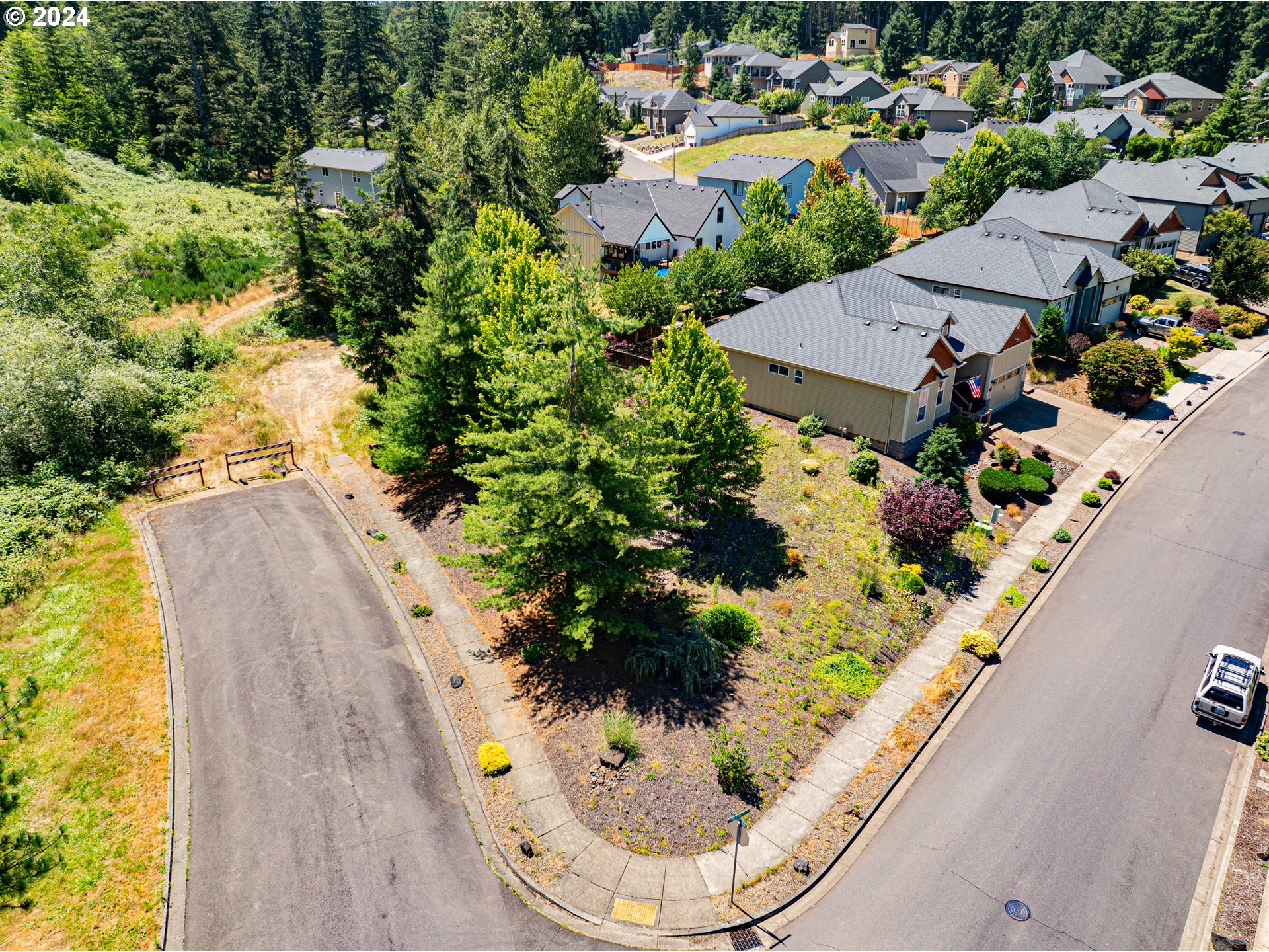 985 Pinetop Street Sweet Home, OR 97386 - Photo 2 of 6 an aerial view of a house with a swimming pool