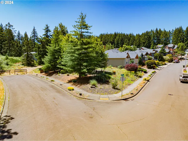 view of a swimming pool with a yard
