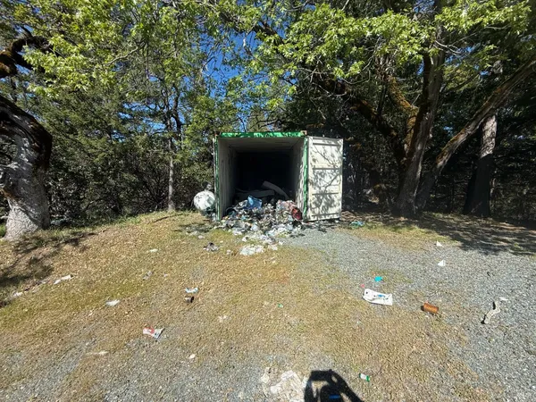 a view of a backyard of the house