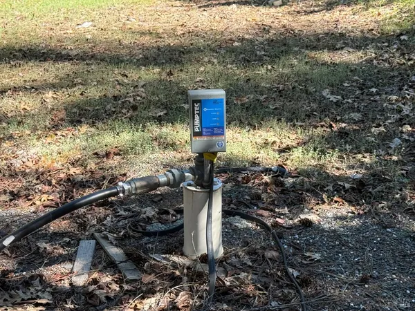 a sign board with a yard