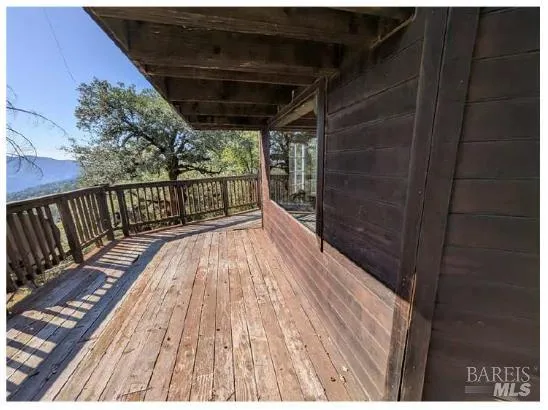 a view of balcony with wooden floor